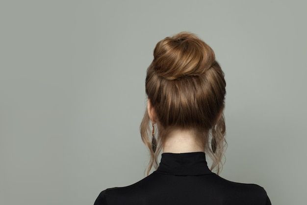Best Hair Accessories to Elevate Your Chignon 3 beautiful woman back with updo hairdo gray background 263368 11901